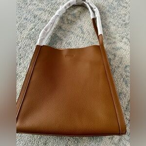 Brand new. Never used. Genuine leather tote bag.